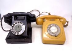 Two Bakelite telephones.