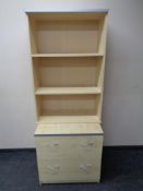 A contemporary shaped office desk with monitor stand together with a pair of three drawer filing