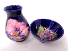 A Moorcroft Magnolia squat bulbous vase (height 9.5cm) together with a Moorcroft finger bowl.