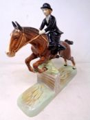 A Beswick figure, Huntswoman jumping sidesaddle no.