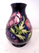 A Moorcroft Anemone pattern squat bulbous vase (height 13.5cm).