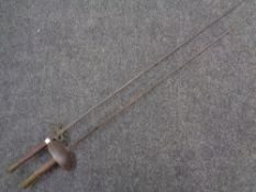 Two fencing swords.