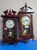 Two contemporary 31 day wall clocks.