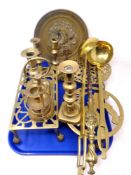 A tray containing antique and later brass ware including trivets, candlesticks, ladle etc.