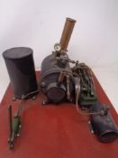 A Stuart Models live steam engine mounted on a wooden board.