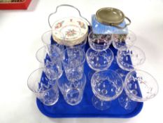 A tray containing a set of dessert bowls on plated stand,