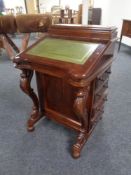 A reproduction Victorian style davenport.