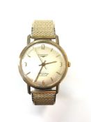 A Gentleman's 9ct yellow gold Longines 'Flagship Automatic' wristwatch, on expansion strap,