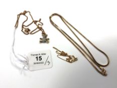 A Swarovski pendant on chain together with a 9ct gold fine necklace (1g) and a further yellow metal