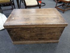 An antique pine blanket box.