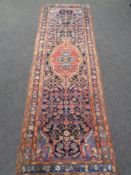 An Iranian Hamadan runner, 280cm by 92cm.