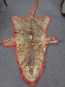 An early 20th century leopard skin shawl.