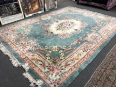 A Chinese carpet on mint ground,