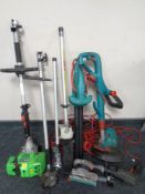 A crate containing a Florabest Petrol garden multi-tool together with a Bosch garden strimmer and