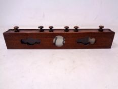An Edwardian mahogany cased scroll desk calendar (as found)