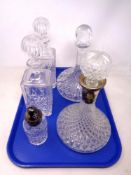 A tray containing a pair of lead crystal whiskey decanters with stoppers together with two further