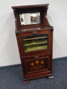 A 19th century Art Nouveau inlaid mahogany music cabinet