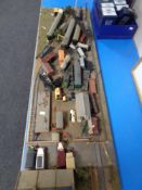 A railway layout on board with buildings and Bachmann rolling stock,