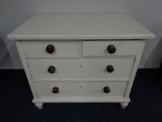 A painted pine two-over-two four drawer chest.