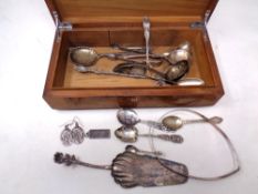 A 20th century walnut table box containing a quantity of silver,