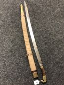A Russian 1881 pattern Russian cossack's sabre in scabbard.