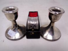 A pair of silver squat candlesticks (height 7cm,