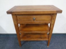 A contemporary pine side table fitted a drawer