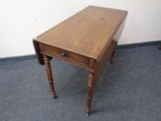 A Victorian mahogany Pembroke table.