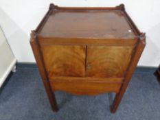 A George III mahogany double door commode cabinet.