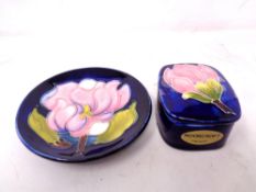 A Moorcroft Magnolia Dish (11cm diameter) together with a lidded trinket pot.