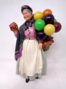 A Royal Doulton figure, Biddy Pennyfarthing HN1843.