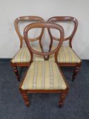 A set of three Victorian mahogany dining chairs.