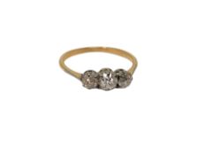 An antique 18ct gold three stone diamond ring, size O CONDITION REPORT: 1.