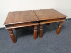A pair of sheesham wood lamp tables.