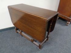 A 20th century oak gate leg table.