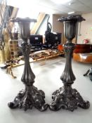 A pair of 19th century ornate pewter candlesticks