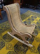 A folding 20th century beech chair together with an antique child's rocking chair.