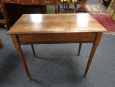 A 19th century mahogany occasional table on club feet.