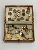 A box of vintage Gentleman's studs including examples in 9ct yellow and white gold with mother of