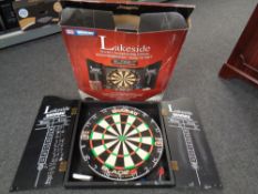 A Winmau dartboard Lakeside World Championship edition in cabinet (boxed).