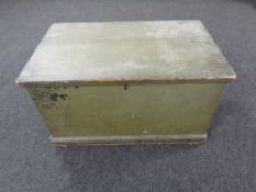 An antique pine blanket box.