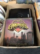 A box containing vinyl LPs including Rod Stewart, ABBA, compilations.