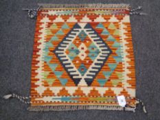 A Chobi kilim 50cm by 49cm