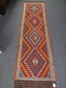 A Suzni kilim runner 260cm by 74cm