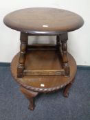 A circular walnut occasional table on ball feet together with a further occasional table.