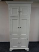 A contemporary six door Neptune 'Chichester' computer cabinet with slide.