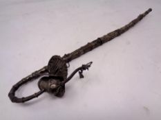 A decorative continental white metal pipe with peacock finial.