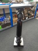 An Edwardian plant stand.