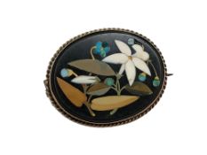 An oval pietra dura brooch in gold frame