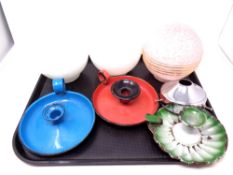 A tray containing three antique tin candlesticks together with three Art Deco light shades.